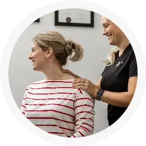 therapist giving shoulder massage